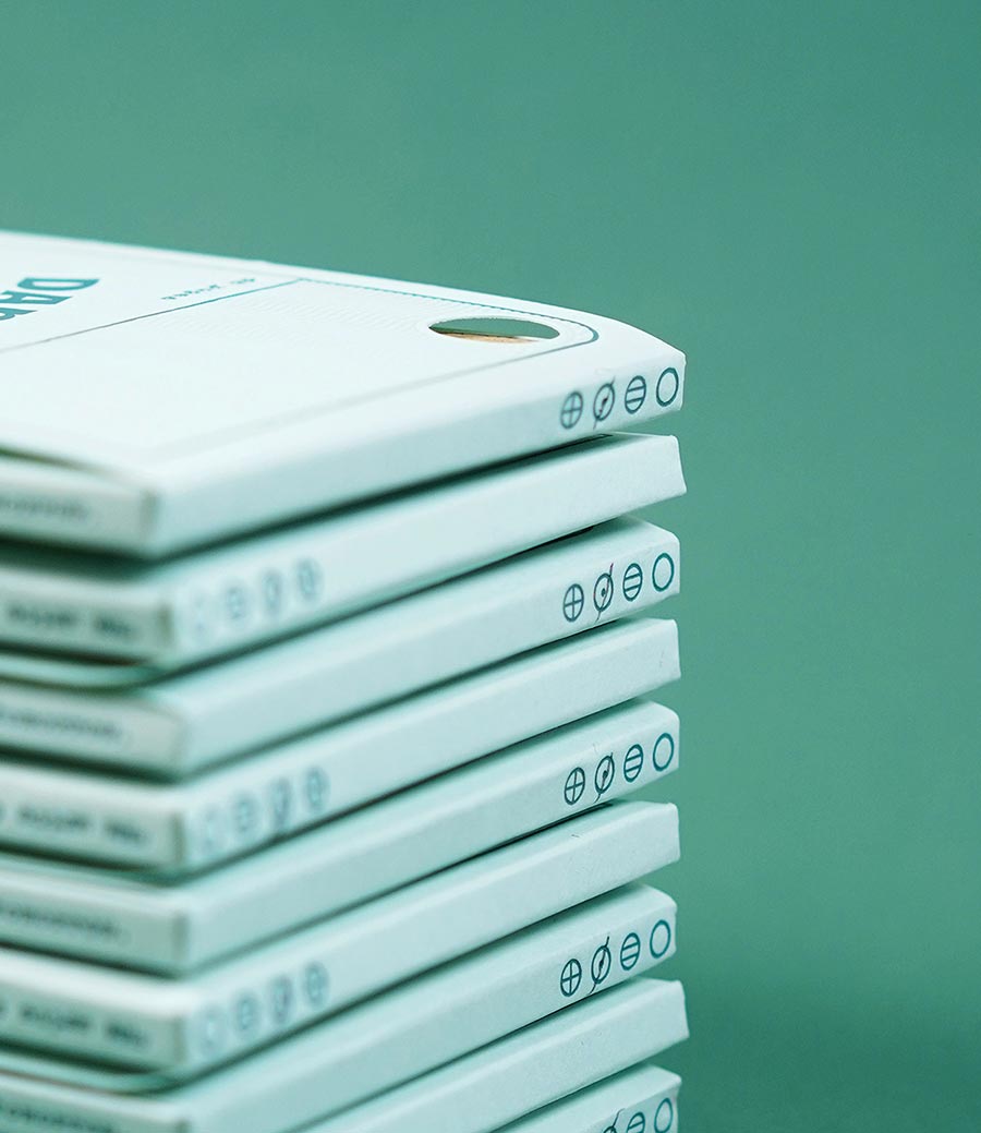an edition's packaging is marked with the dot grid letterpressed marker checked off in pencil