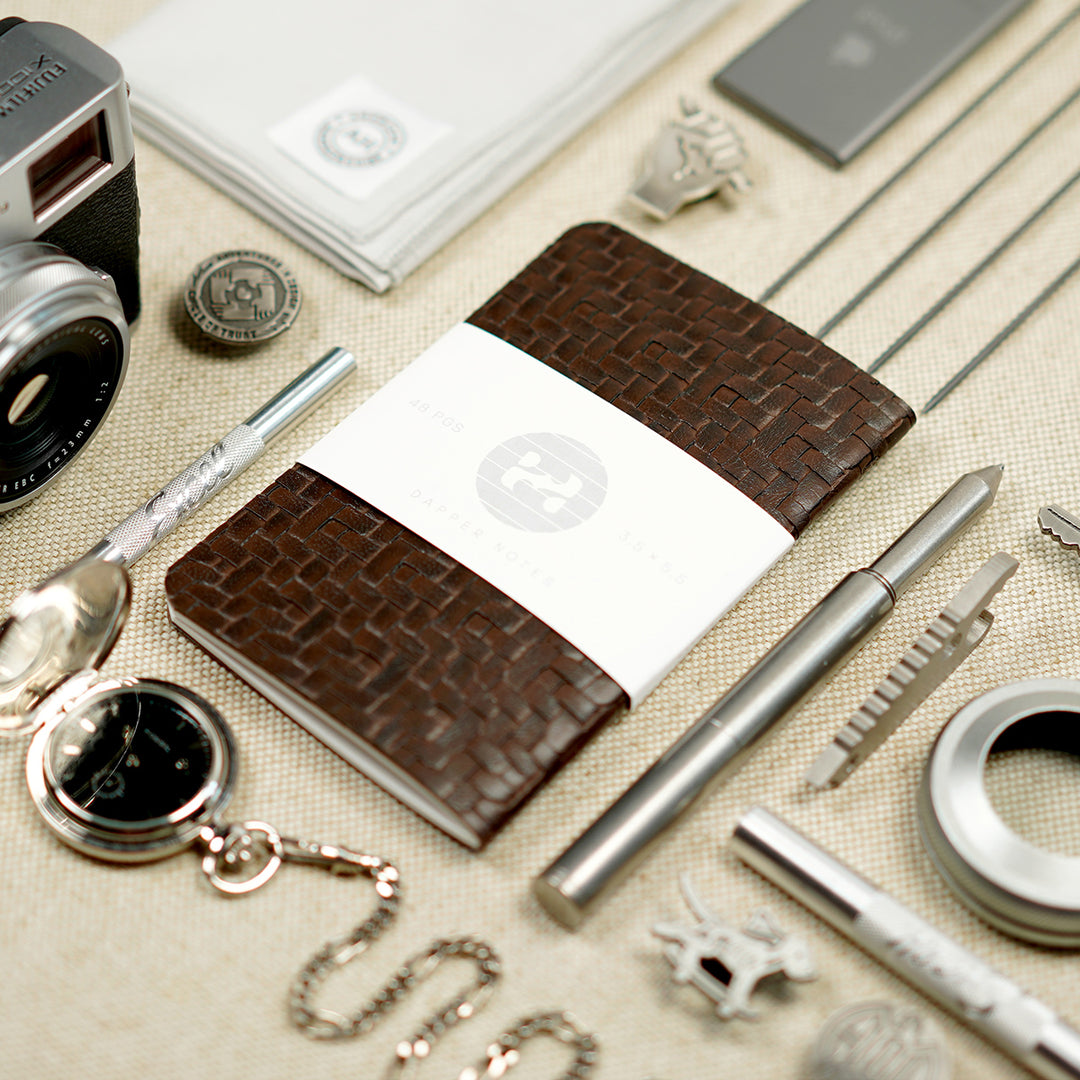 arranging items neatly notebook EDC pen, exacto, camera, fujifilm x100f, handkerchief  