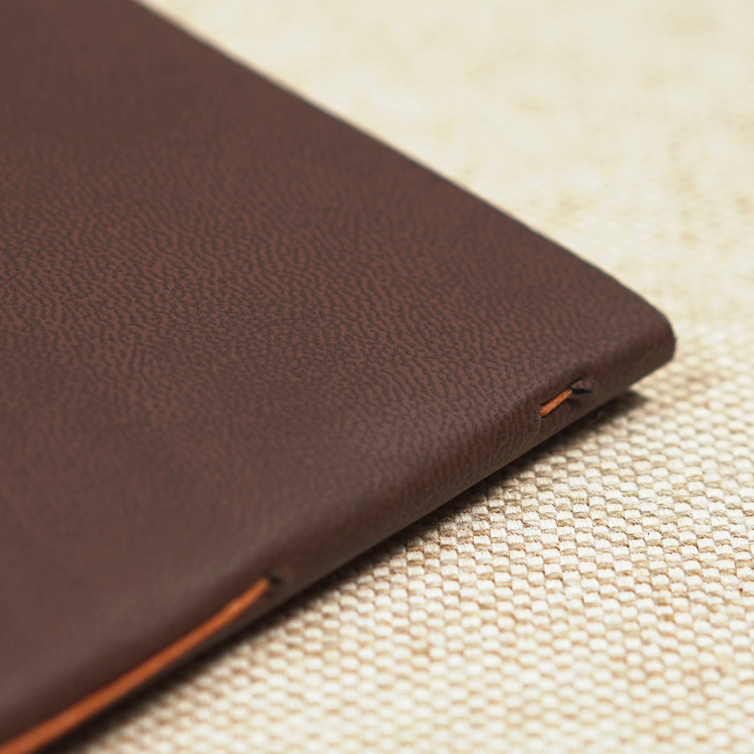 orange thread on leather cover
